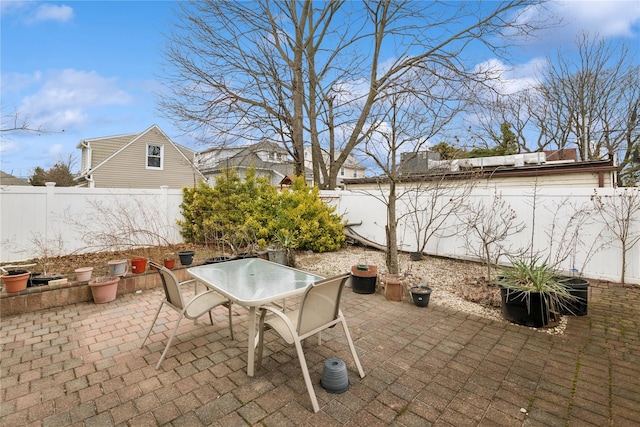 view of patio / terrace with outdoor dining area and a fenced backyard