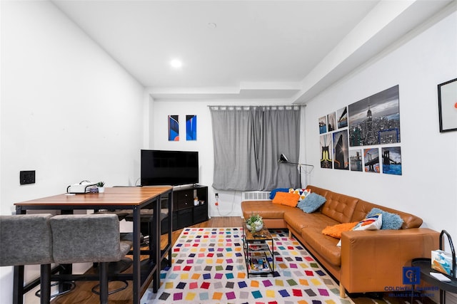 living room featuring recessed lighting, visible vents, and wood finished floors