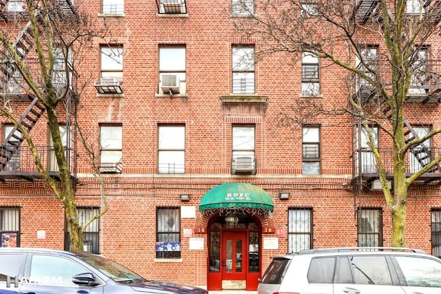 view of building exterior with cooling unit