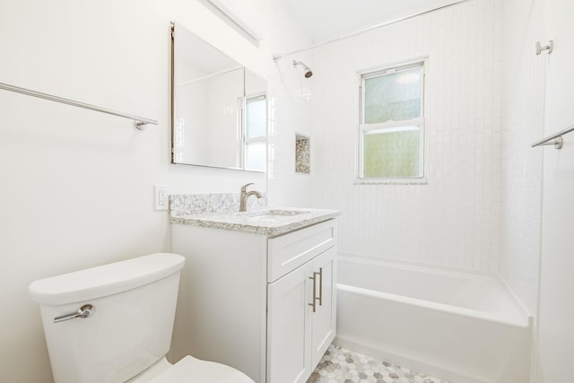 full bath featuring toilet, vanity, and shower / tub combination