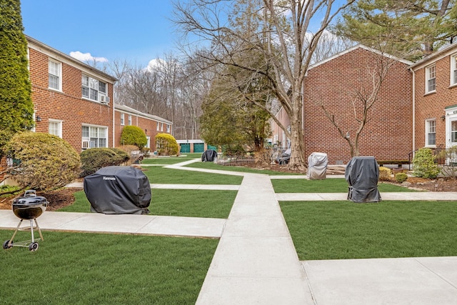 view of home's community featuring a lawn