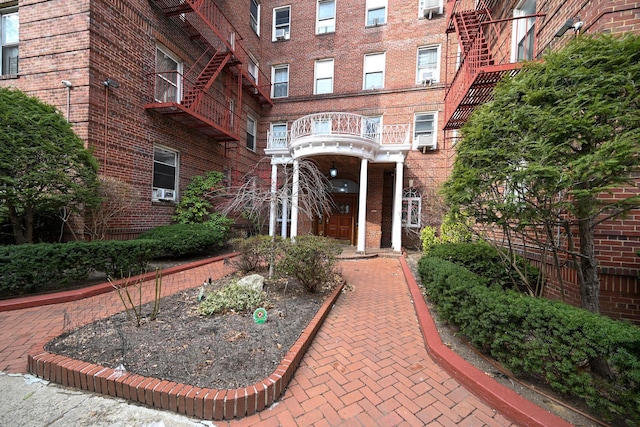 property entrance with brick siding