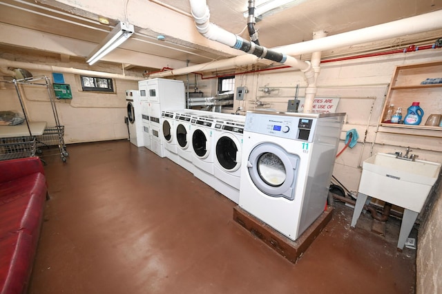 common laundry area with washing machine and clothes dryer