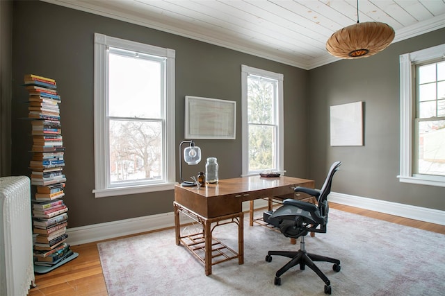 office area with baseboards, ornamental molding, radiator, and wood finished floors