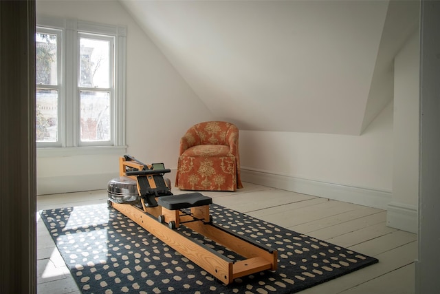 bonus room featuring wood finished floors and vaulted ceiling