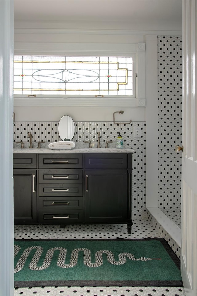 bathroom featuring double vanity and a sink