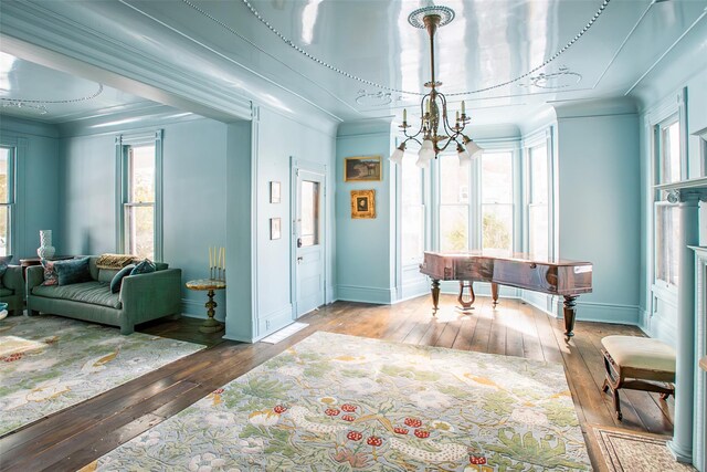 25 Prospect Ave, Catskill, NY 12414 - foyer entrance with hardwood / wood-style floors, a chandelier, baseboards, and crown molding