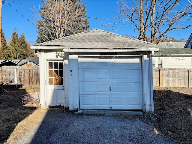 detached garage with fence