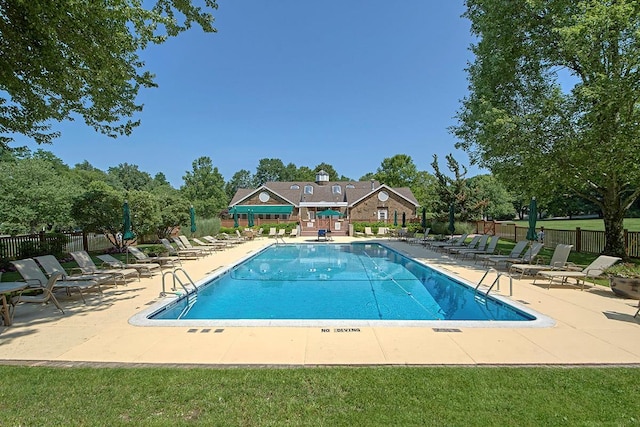 pool featuring a patio and fence