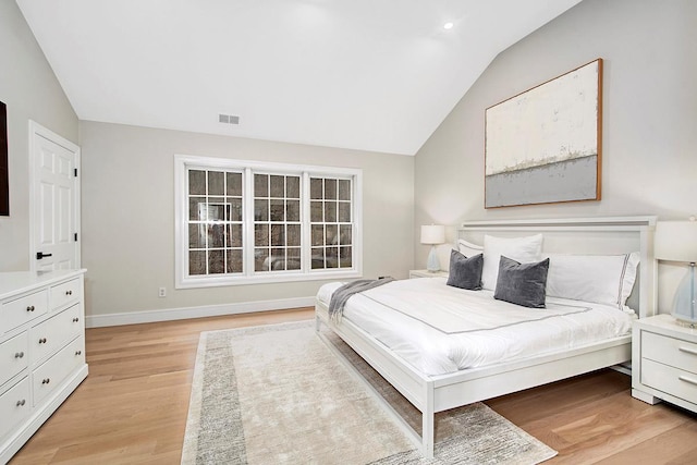 bedroom featuring lofted ceiling, recessed lighting, visible vents, baseboards, and light wood finished floors