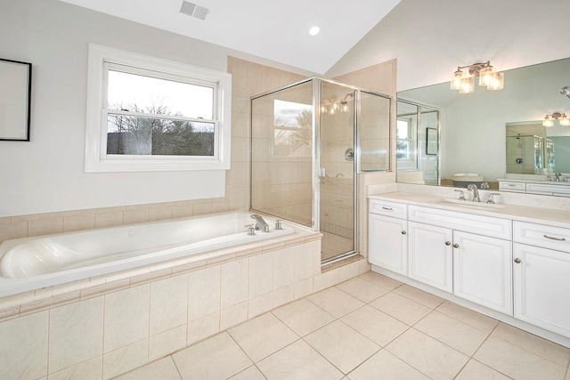 full bath featuring a garden tub, lofted ceiling, visible vents, a shower stall, and vanity