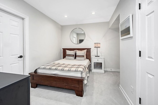 bedroom with recessed lighting, light colored carpet, and baseboards