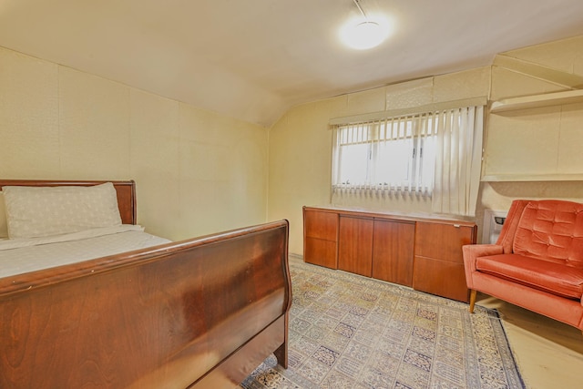 bedroom featuring vaulted ceiling