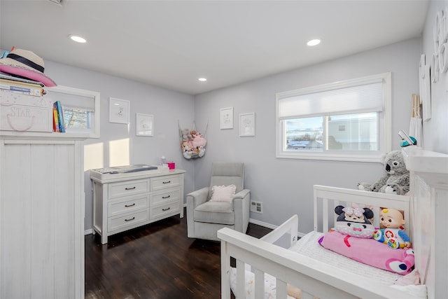 bedroom with dark wood finished floors, visible vents, and recessed lighting