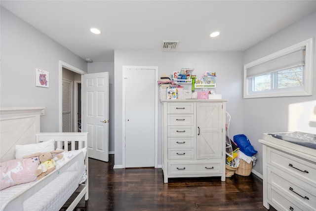 bedroom featuring dark wood-style flooring, visible vents, and recessed lighting