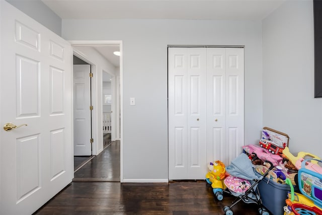 rec room with wood finished floors and baseboards