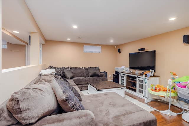 living room with wood finished floors and recessed lighting