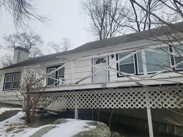 view of home's exterior with a chimney