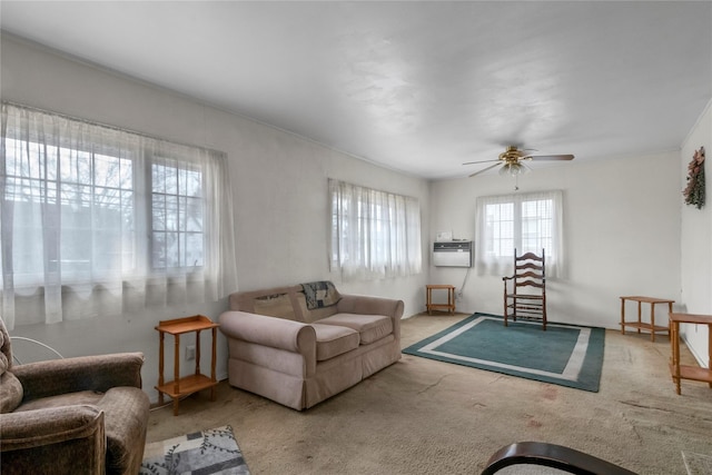 living area featuring carpet flooring and ceiling fan