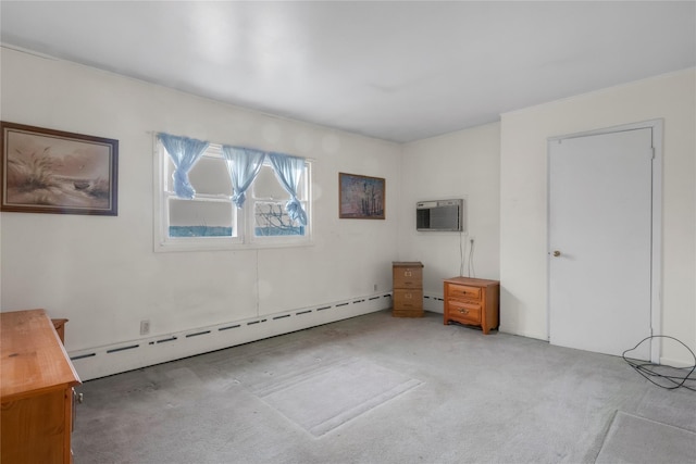 interior space featuring carpet floors, a wall mounted air conditioner, and a baseboard radiator