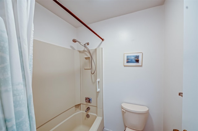 bathroom with shower / bathtub combination with curtain and toilet