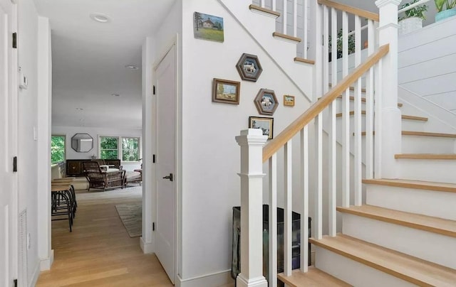 12 Bob White Dr, Water Mill, NY 11976 - stairway with wood finished floors and recessed lighting