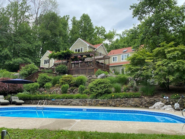 outdoor pool featuring a deck