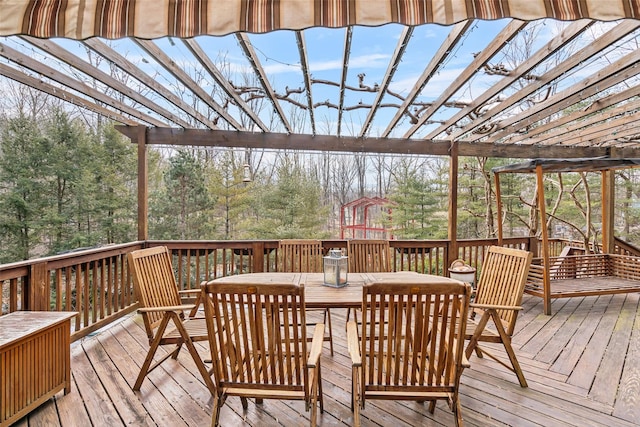 wooden deck featuring outdoor dining space and a pergola