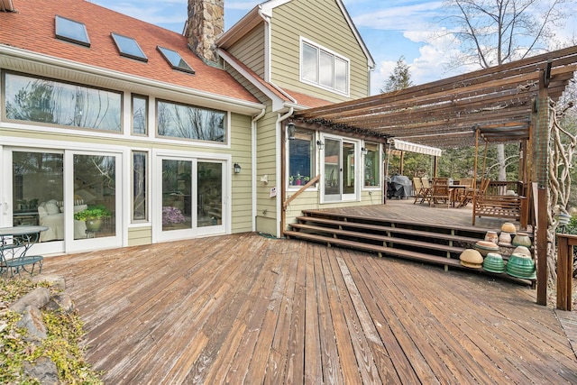 wooden deck with outdoor dining area