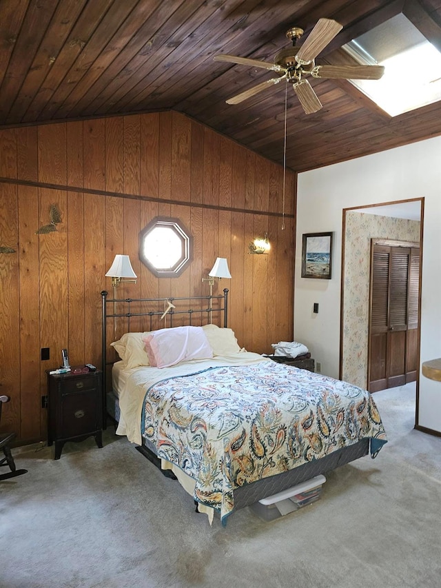 bedroom with vaulted ceiling, wooden ceiling, light carpet, and wood walls