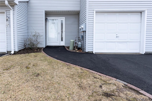 doorway to property featuring a garage