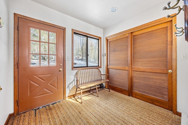 entryway featuring baseboards