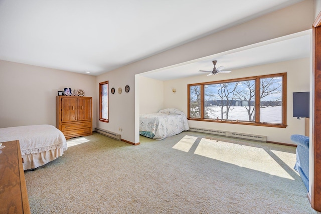 bedroom featuring carpet floors, baseboards, a baseboard heating unit, and ceiling fan