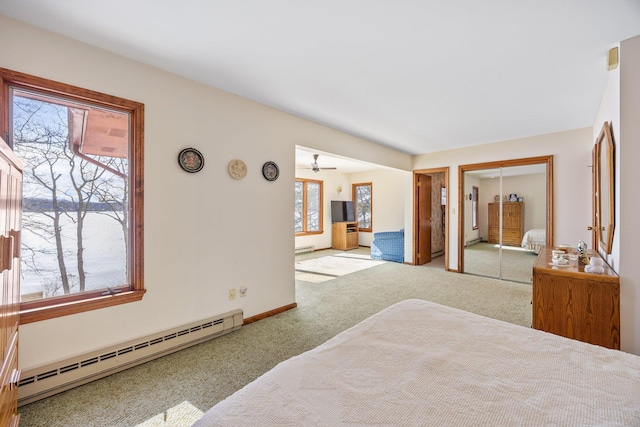 bedroom featuring a baseboard radiator, baseboards, baseboard heating, and carpet flooring