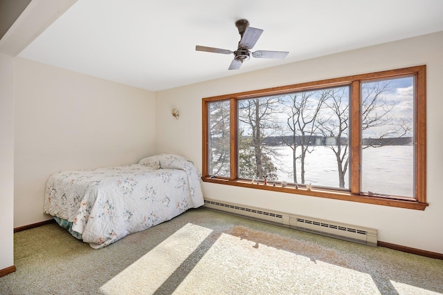 carpeted bedroom featuring baseboards, ceiling fan, and baseboard heating