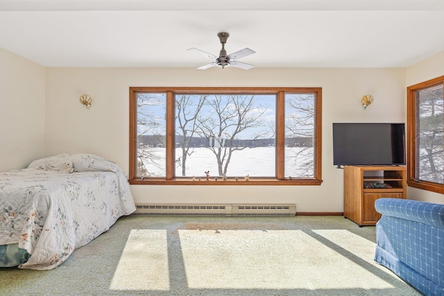 bedroom with ceiling fan, baseboards, baseboard heating, and light colored carpet