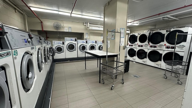 shared laundry area featuring stacked washer / dryer and washer and dryer