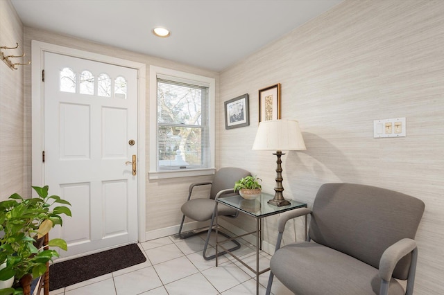 foyer entrance featuring light tile patterned floors, baseboards, and recessed lighting