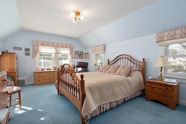 bedroom with lofted ceiling, carpet floors, multiple windows, and visible vents