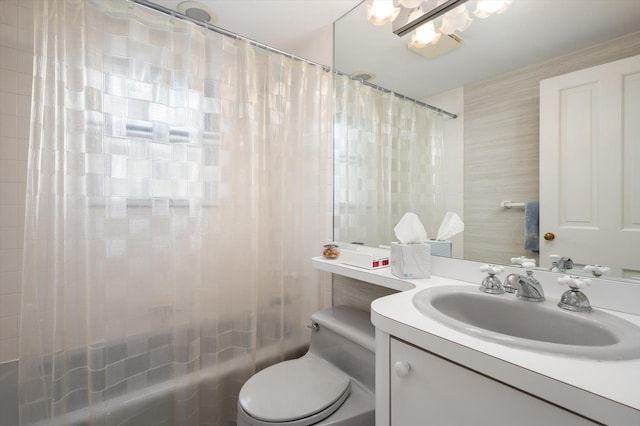 bathroom featuring shower / bath combo, vanity, and toilet