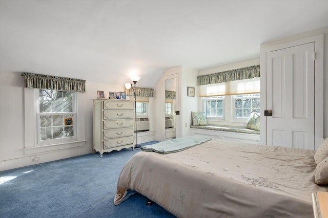 bedroom with carpet floors and lofted ceiling