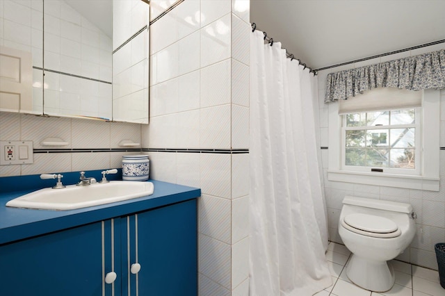 bathroom featuring tile patterned flooring, toilet, vanity, tile walls, and a shower with curtain