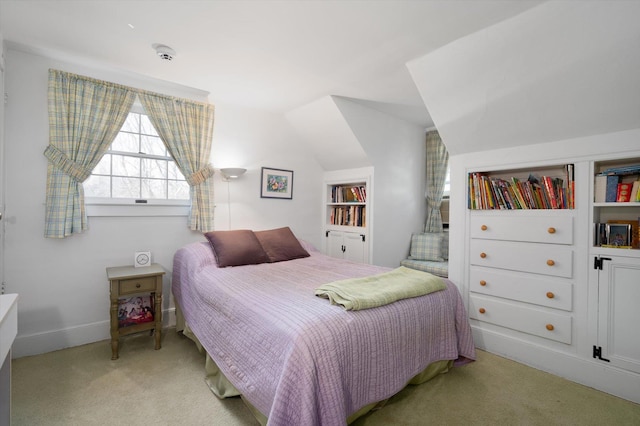 bedroom with light carpet and vaulted ceiling