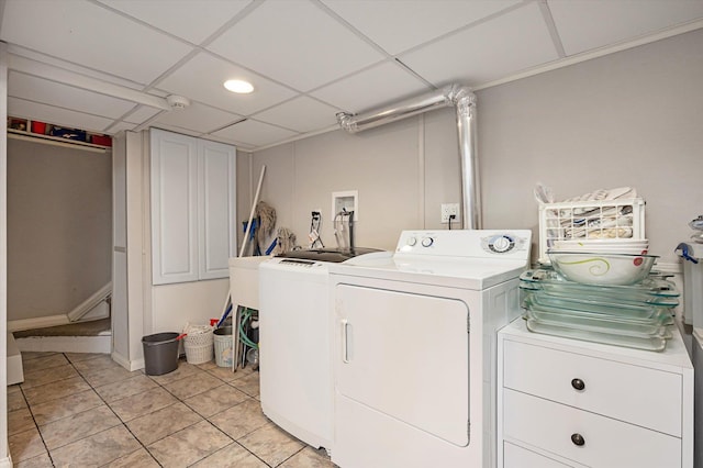 washroom featuring laundry area, separate washer and dryer, and light tile patterned flooring