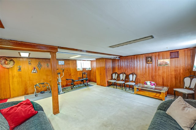 interior space with carpet floors and wooden walls