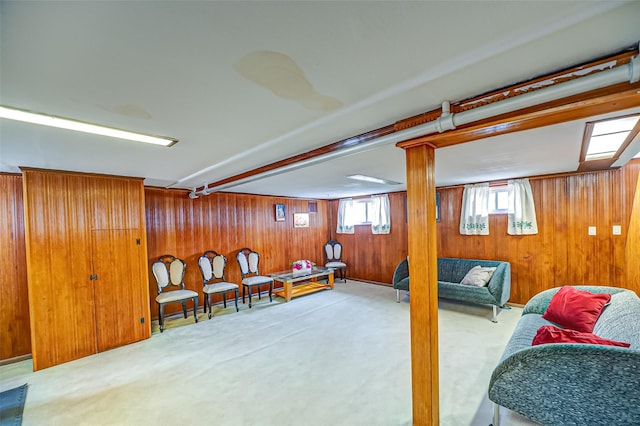 interior space featuring carpet and wooden walls