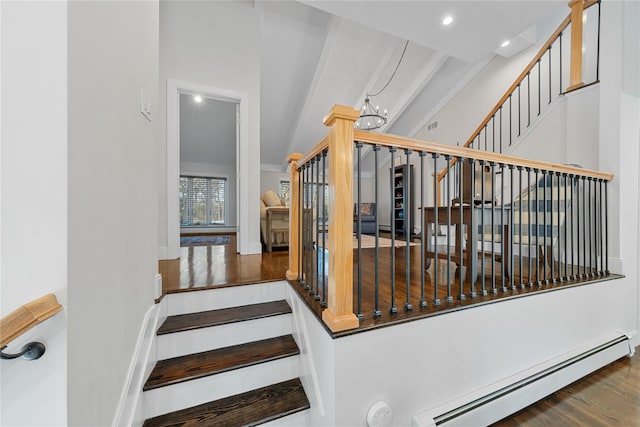 stairway featuring a baseboard heating unit, a notable chandelier, wood finished floors, and recessed lighting