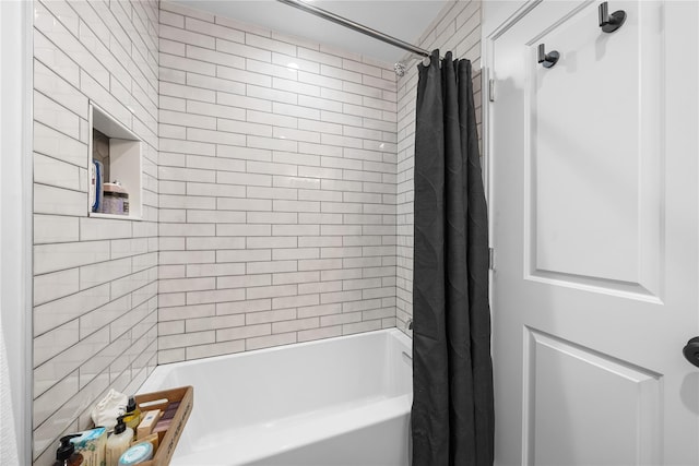 bathroom with shower / bathtub combination with curtain