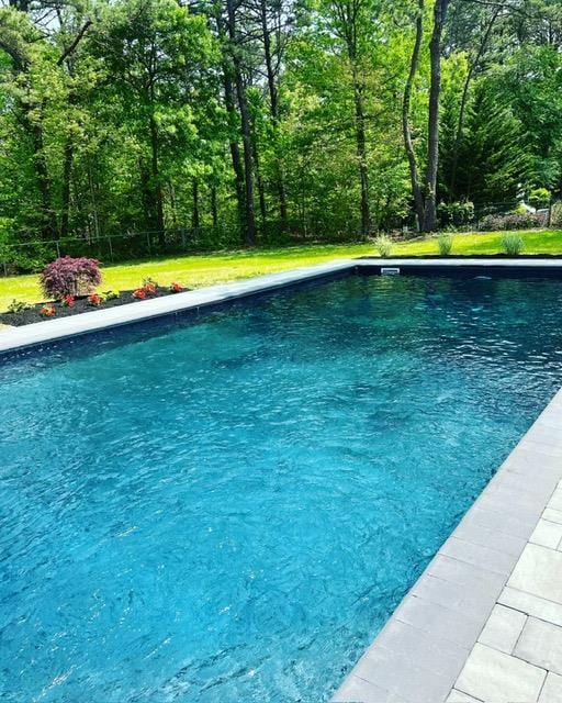 pool featuring a forest view