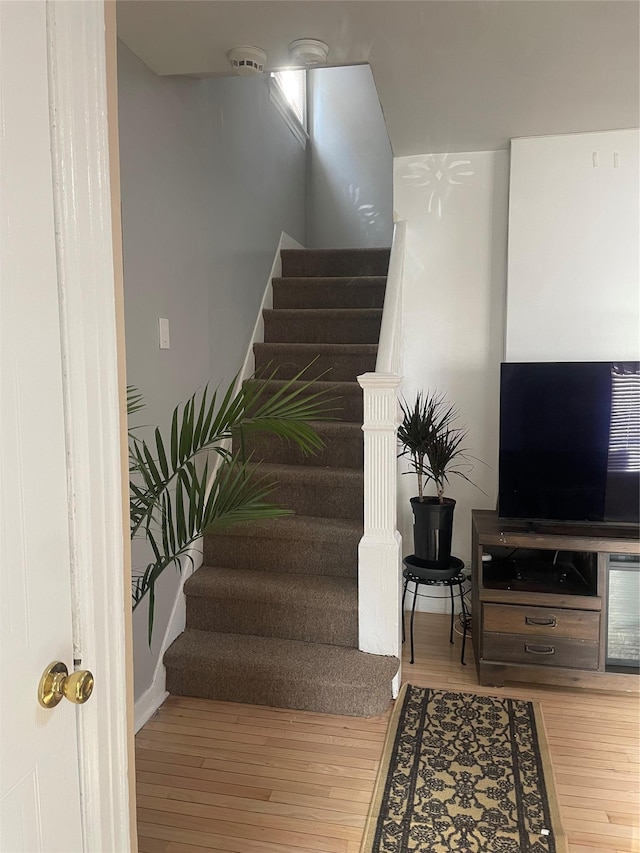 113-21 203rd St, Saint Albans, NY 11412 - staircase featuring wood finished floors